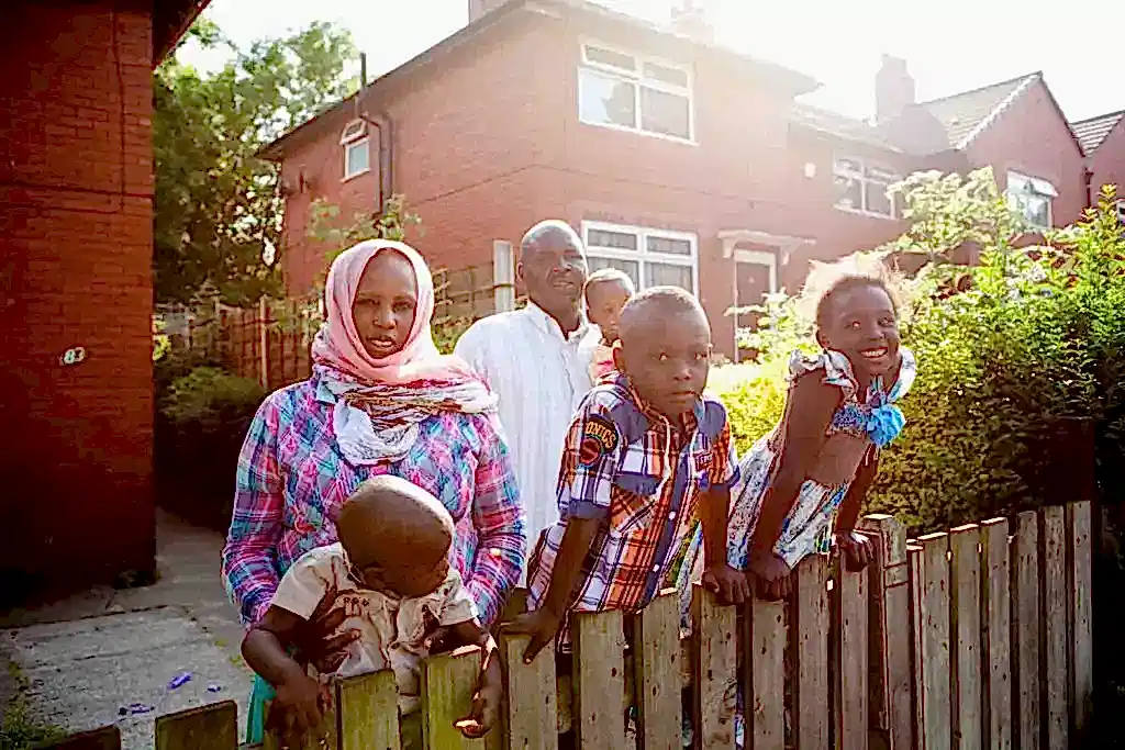 Family in their front garden